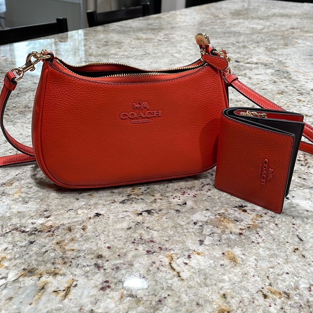 Limited Edition Authentic Coach bag with matching Coach wallet.